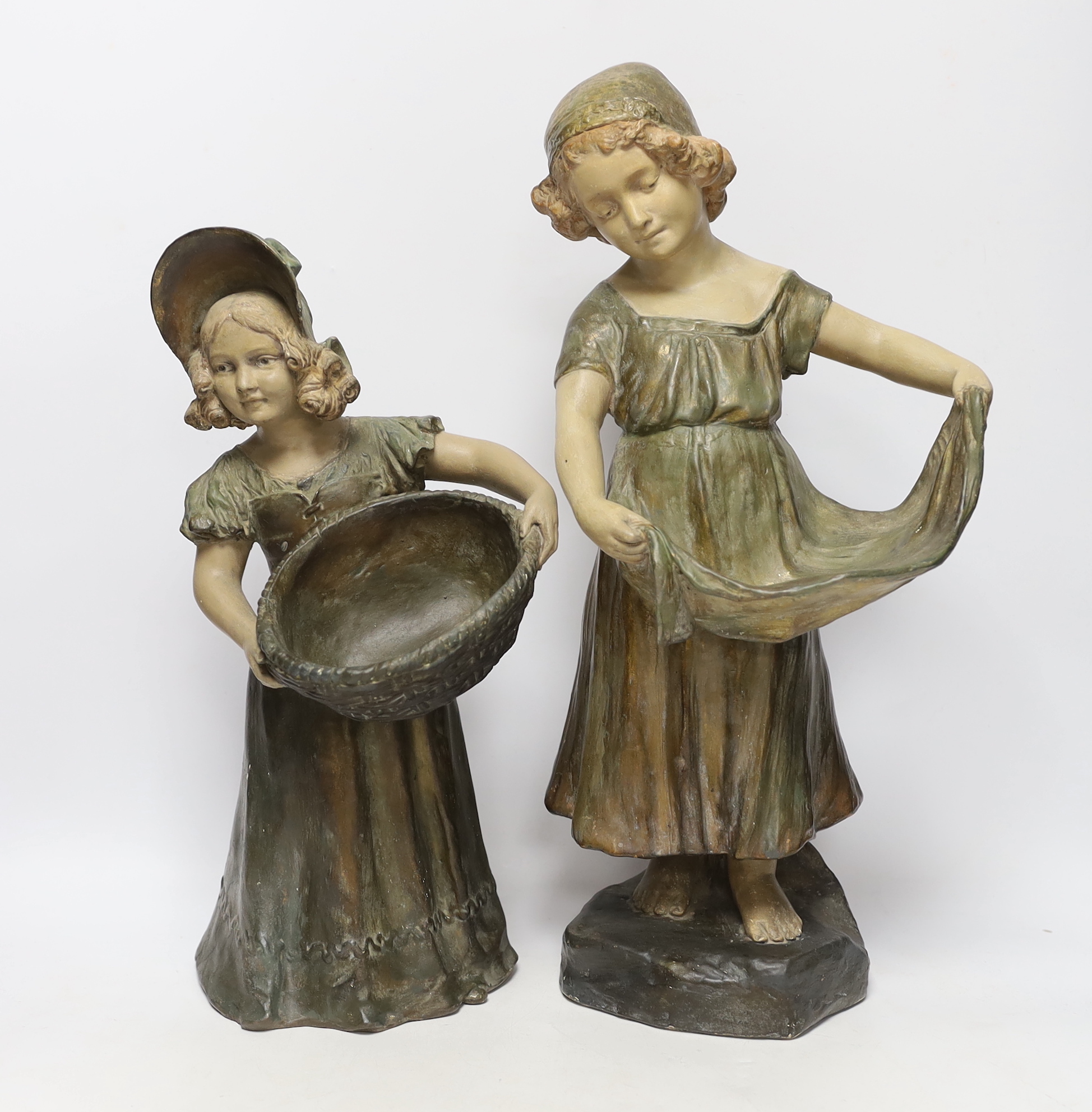 A pair of Austrian cold painted terracotta figurines, largest 45cm high